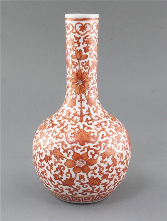 A Chinese iron red painted bottle vase, Qianlong mark but late 19th/early 20th century, height 25.8cm